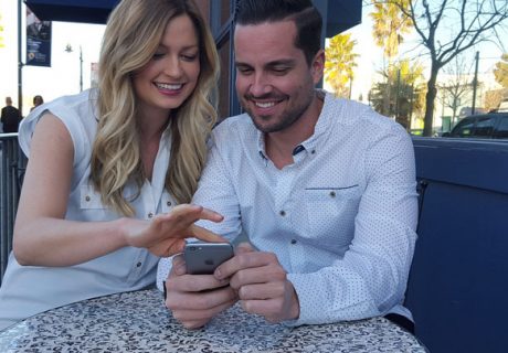 Millennial couple shop on boat website